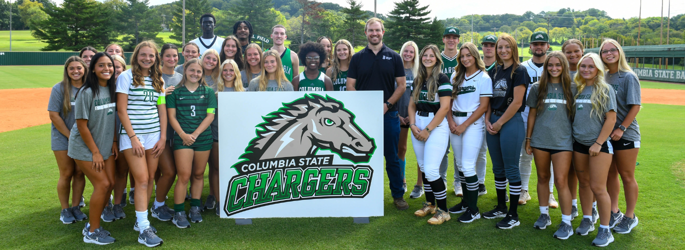 Student athletes pose with Jack Maher