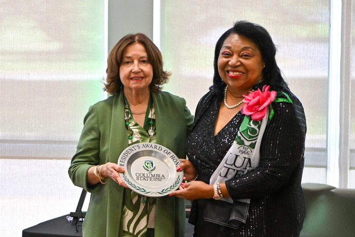 Dr. Janet F. Smith, Columbia State president, presents Vanessa English Alderson with the President’s Award of Honor for Distinguished Alumni.