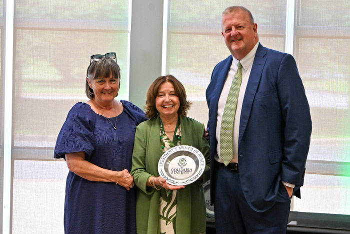 Dr. Janet F. Smith, Columbia State president, presents Dr. Jeff Adams and Tina Adams with President’s Award of Honor for Distinguished Service.