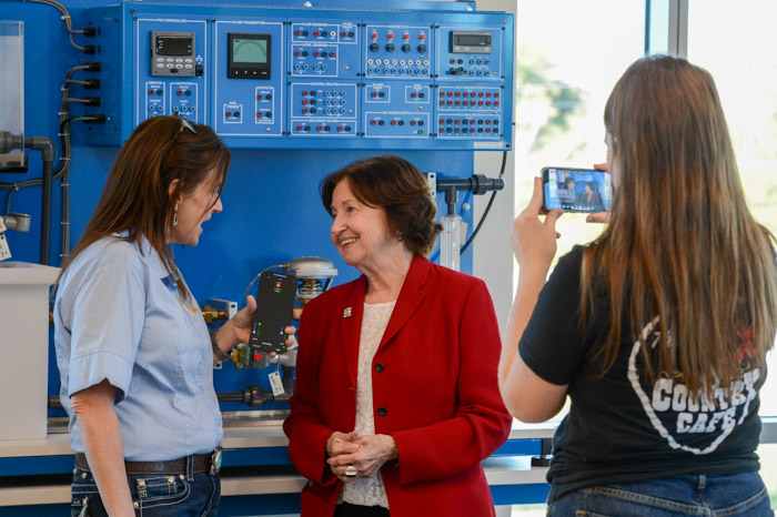 Dr. Janet F. Smith, Columbia State president (center), is interviewed by Charlotte Stremler, vice president/station manager for Lawrenceburg-based radio stations WLLX, WLXA, WWLX and WDXE, in the new EST lab on the Lawrence Campus.