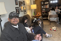 Smiling student with other students in the background