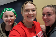 Three smiling young ladies